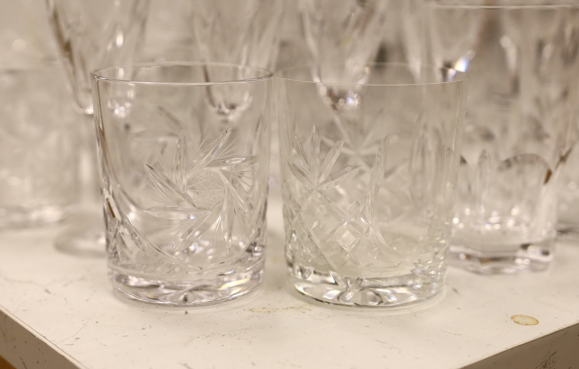 A suite of Hungarian cut drinking glassware, together with other glass